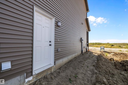 Separate Entrance - 5458 Hawthorn Run, Edmonton, AB - Outdoor With Exterior