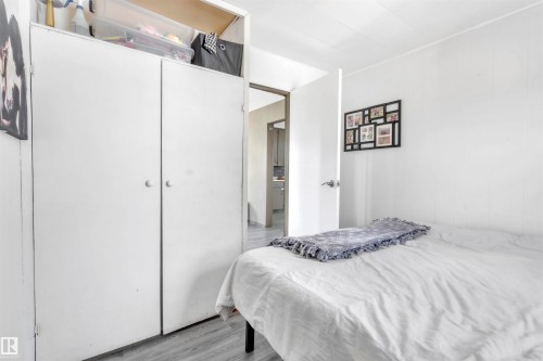 Bedroom featuring light wood-type flooring and a closet - 4702 50 Avenue, Cold Lake, AB - Indoor Photo Showing Bedroom