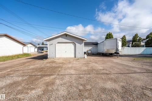 Detached garage featuring driveway - 4702 50 Avenue, Cold Lake, AB - Outdoor
