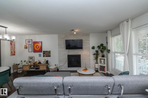 7409 22 Ave, Edmonton, AB - Indoor Photo Showing Bedroom With Fireplace
