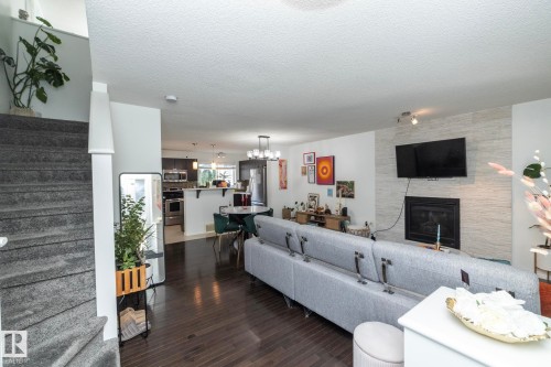 7409 22 Ave, Edmonton, AB - Indoor Photo Showing Living Room With Fireplace