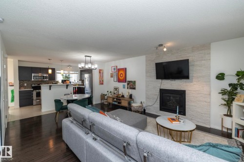 7409 22 Ave, Edmonton, AB - Indoor Photo Showing Living Room With Fireplace
