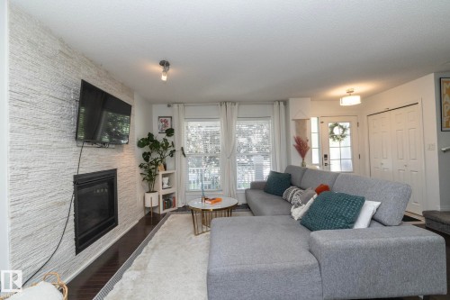 7409 22 Ave, Edmonton, AB - Indoor Photo Showing Living Room With Fireplace