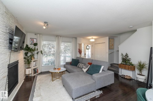 7409 22 Ave, Edmonton, AB - Indoor Photo Showing Living Room With Fireplace