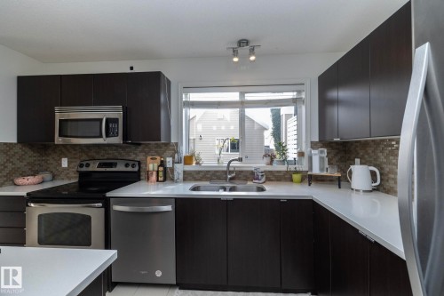 7409 22 Ave, Edmonton, AB - Indoor Photo Showing Kitchen With Stainless Steel Kitchen With Double Sink