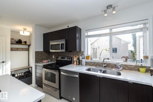 7409 22 Ave, Edmonton, AB - Indoor Photo Showing Kitchen With Stainless Steel Kitchen With Double Sink