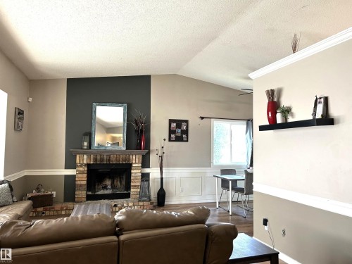 166 West Liberty Crescent, Millet, AB - Indoor Photo Showing Living Room With Fireplace