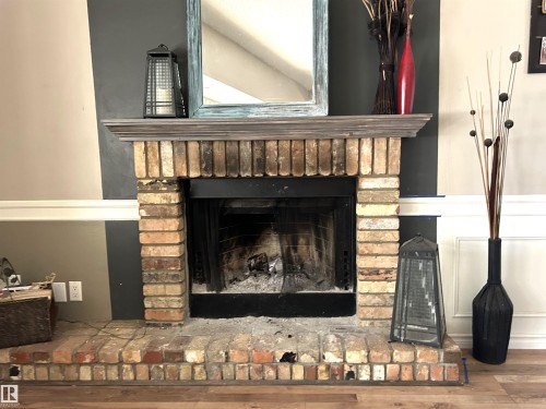 166 West Liberty Crescent, Millet, AB - Indoor Photo Showing Living Room With Fireplace