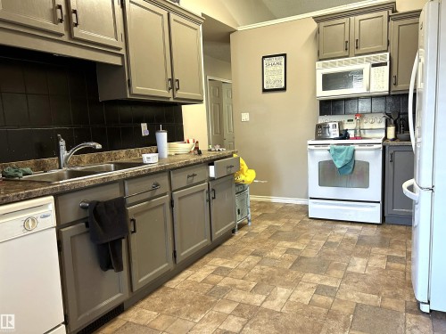 166 West Liberty Crescent, Millet, AB - Indoor Photo Showing Kitchen With Double Sink