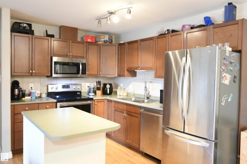 130 50 Woodsmere, Fort Saskatchewan, AB - Indoor Photo Showing Kitchen With Double Sink