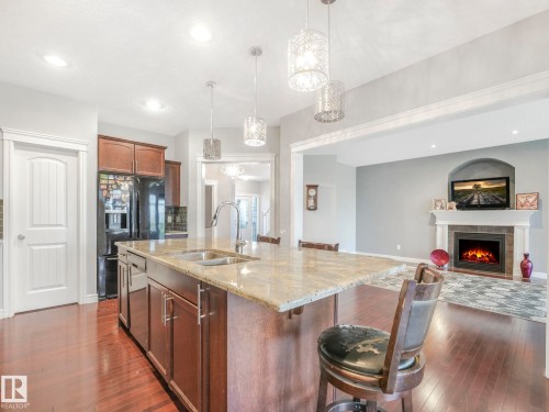 1703 33B Street, Edmonton, AB - Indoor Photo Showing Kitchen With Fireplace With Double Sink