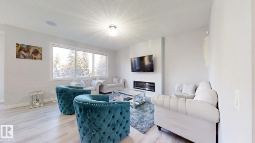 215 Glenridding Ravine Road, Edmonton, AB - Indoor Photo Showing Living Room With Fireplace
