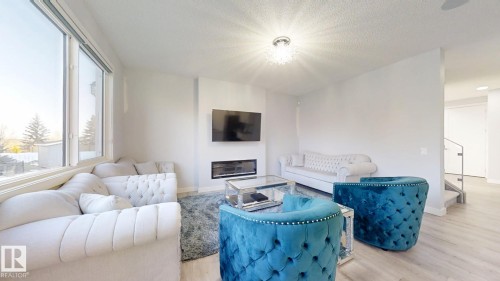 215 Glenridding Ravine Road, Edmonton, AB - Indoor Photo Showing Living Room With Fireplace