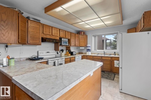 1102 13 Avenue, Cold Lake, AB - Indoor Photo Showing Kitchen With Double Sink