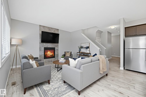 7310 Edgemont Way, Edmonton, AB - Indoor Photo Showing Living Room With Fireplace