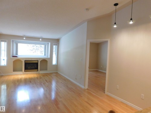 103 Falconer Court Nw, Edmonton, AB - Indoor Photo Showing Other Room With Fireplace