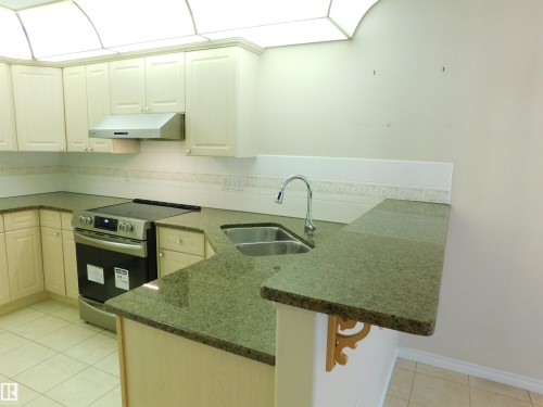 103 Falconer Court Nw, Edmonton, AB - Indoor Photo Showing Kitchen With Double Sink