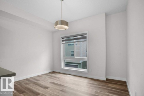 38 979 Crystallina Nera Way, Edmonton, AB - Indoor With Fireplace