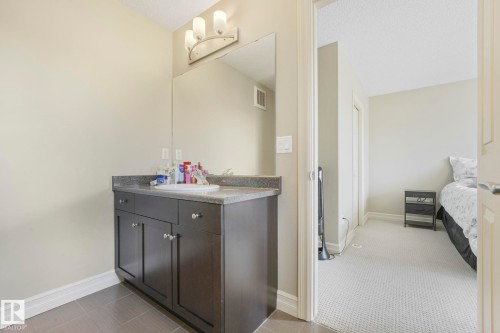 Bathroom with vanity and light tile patterned flooring - 6819 Cardinal Link, Edmonton, AB - Indoor