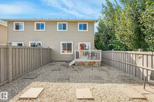 Rear view of property featuring a fenced backyard and a deck - 6819 Cardinal Link, Edmonton, AB - Outdoor With Deck Patio Veranda With Exterior