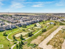 Aerial perspective of suburban area with a large body of water - 