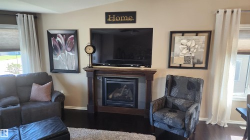 5810 Centennial Drive, Elk Point, AB - Indoor Photo Showing Living Room With Fireplace