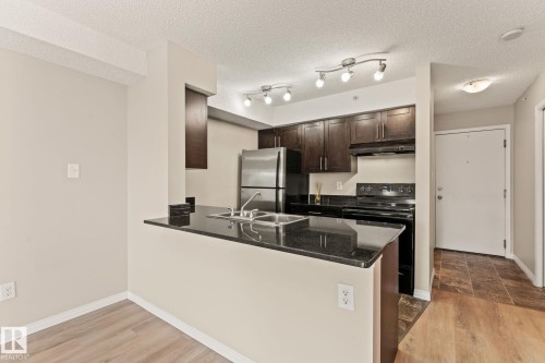 407 1060 Mcconachie Boulevard, Edmonton, AB - Indoor Photo Showing Kitchen With Double Sink
