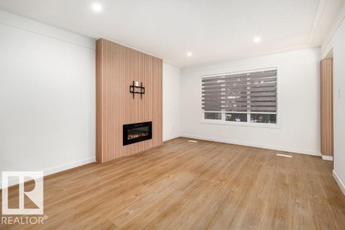 8522/8524 84 Avenue, Edmonton, AB - Indoor Photo Showing Living Room With Fireplace