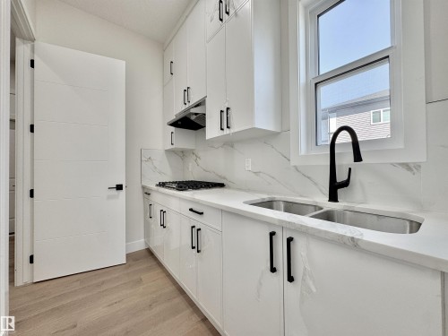 7027 Kiviaq Crescent, Edmonton, AB - Indoor Photo Showing Kitchen With Double Sink