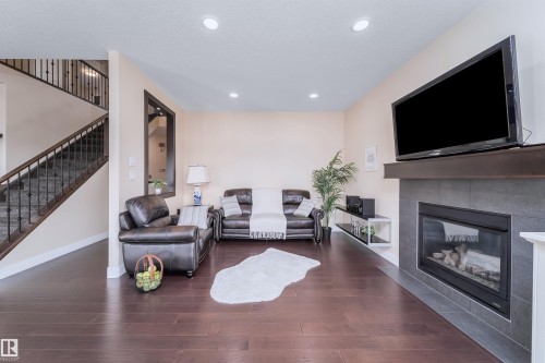 8967 24 Avenue, Edmonton, AB - Indoor Photo Showing Living Room With Fireplace