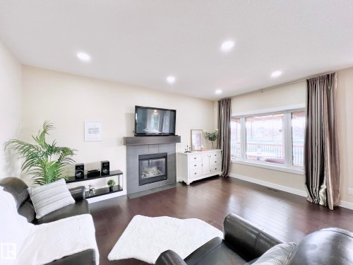 8967 24 Avenue, Edmonton, AB - Indoor Photo Showing Living Room With Fireplace