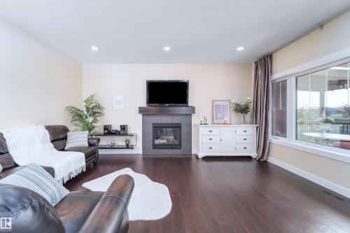 8967 24 Avenue, Edmonton, AB - Indoor Photo Showing Living Room With Fireplace