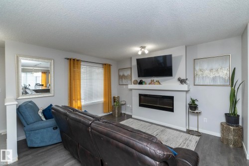 7712 Eifert Crescent, Edmonton, AB - Indoor Photo Showing Living Room With Fireplace