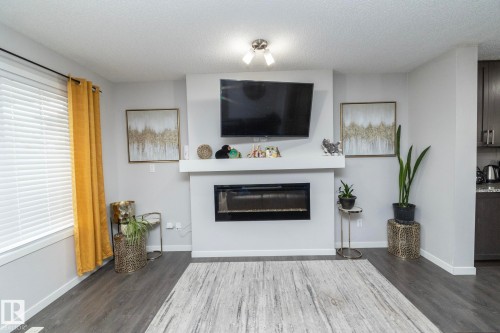 7712 Eifert Crescent, Edmonton, AB - Indoor Photo Showing Living Room With Fireplace