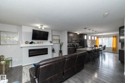 7712 Eifert Crescent, Edmonton, AB - Indoor Photo Showing Living Room With Fireplace