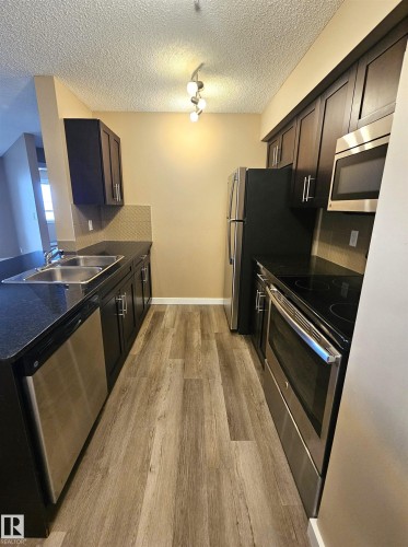 313 1510 Watt Drive, Edmonton, AB - Indoor Photo Showing Kitchen With Stainless Steel Kitchen With Double Sink