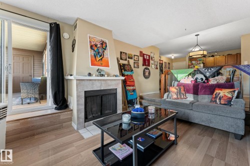 202 2904 139 Avenue, Edmonton, AB - Indoor Photo Showing Living Room With Fireplace
