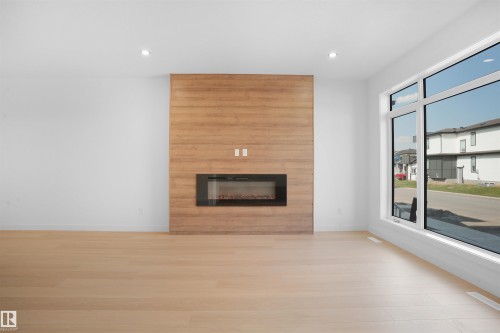 82 Blackbird Bend, Fort Saskatchewan, AB - Indoor Photo Showing Living Room With Fireplace
