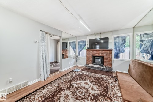 2343 139 Avenue, Edmonton, AB - Indoor Photo Showing Living Room With Fireplace