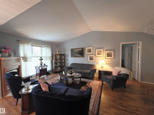 208 Ravine Villa(S), Leduc, AB - Indoor Photo Showing Living Room With Fireplace