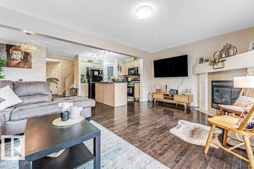 1137 37B Avenue, Edmonton, AB - Indoor Photo Showing Living Room With Fireplace