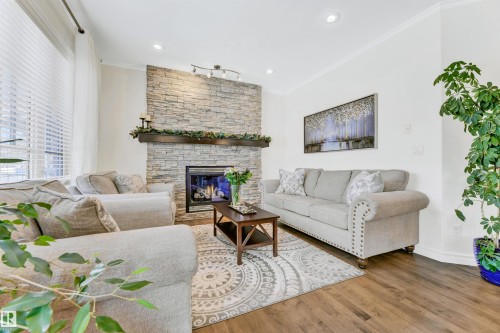 2677 Anderson Crescent, Edmonton, AB - Indoor Photo Showing Living Room With Fireplace