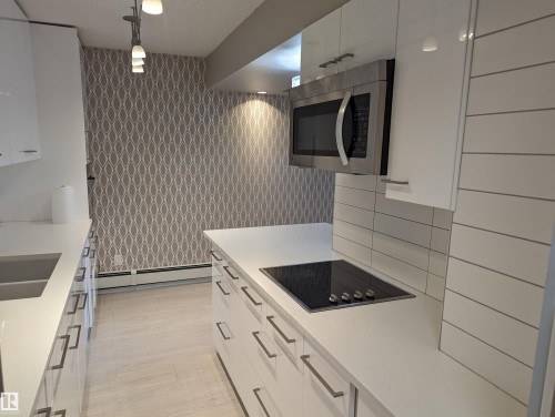 105 10140 115 Street, Edmonton, AB - Indoor Photo Showing Kitchen With Double Sink