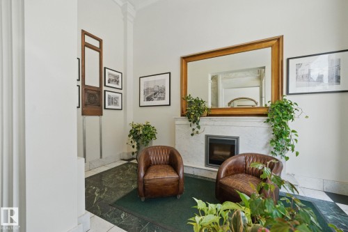 703 10134 100 Street, Edmonton, AB - Indoor Photo Showing Other Room With Fireplace
