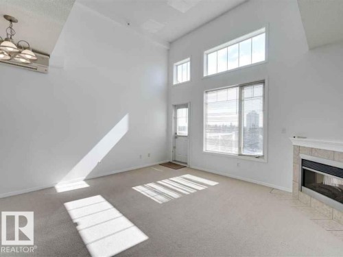 Edmonton, AB - Indoor Photo Showing Other Room With Fireplace