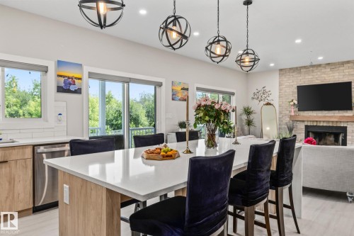 5225 55 55St, Wabamun, AB - Indoor Photo Showing Dining Room With Fireplace