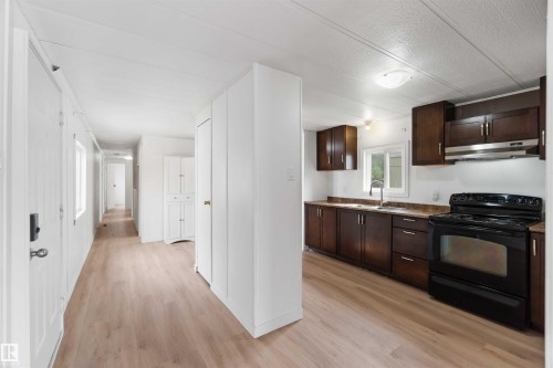 215 305 Calahoo Road, Spruce Grove, AB - Indoor Photo Showing Kitchen With Double Sink