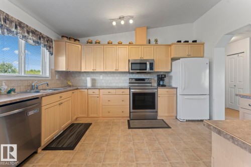 3808 2Nd Street, Mallaig, AB - Indoor Photo Showing Kitchen With Double Sink