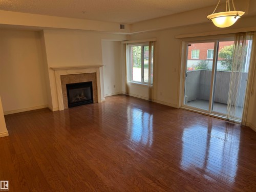 112 260 Sturgeon Road, St. Albert, AB - Indoor Photo Showing Living Room With Fireplace