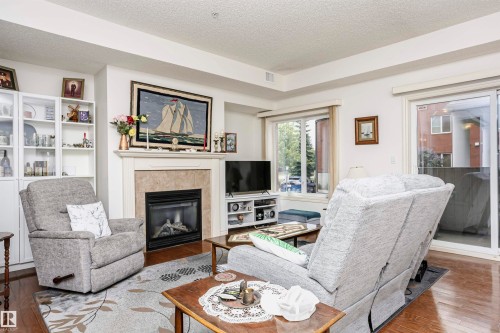 112 260 Sturgeon Road, St. Albert, AB - Indoor Photo Showing Living Room With Fireplace
